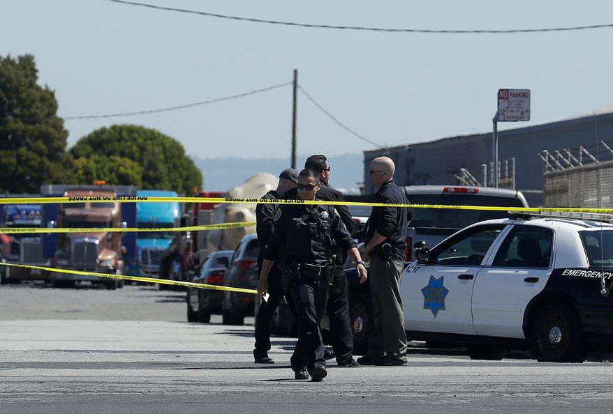 FILE--In this March 28, 2018, file photo, San Francisco Police officers work near where police say a driver got into an altercation with several people and struck them with his vehicle before fleeing in San Francisco. The suspect who drove his van into a group of friends, killing one and injuring four, initially came at the group with an ax, the friends and court records say. (AP Photo/Jeff Chiu,file)