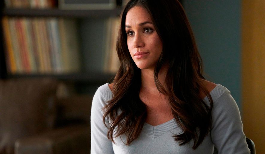 In this file image released by USA Network, Meghan Markle appears in a scene from "Suits." Real life will imitate art this spring at the USA series “Suits” when series regular Markle bids farewell to the legal drama in a wedding - and then goes off to marry her prince in real life. (Ian Watson/USA Network via AP, File)