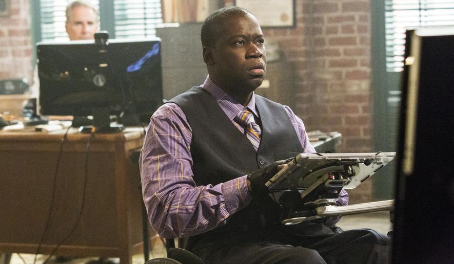 This image released by CBS shows disabled actor Daryl Mitchell in a scene from "NCIS: New Orleans." Mitchell, who is paralyzed as a result of a motorcycle accident in 2001, has starred in a variety of films and TV series. He is currently a series regular on the "NCIS" spin-off series. (Skip Bolen/CBS via AP)