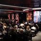 People watch the NBA 2K League draft Wednesday, April 4, 2018, in New York. Launching in 2018, the league will feature the best NBA 2K players in the world and will draft players to compete as unique characters in 5-on-5 play against the other teams in a mix of regular-season games, tournaments and playoffs. (AP Photo/Frank Franklin II) **FILE**