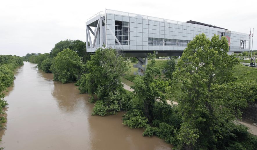 FILE - This Wednesday, May 13, 2015 file photo shows the Clinton Presidential Library in Little Rock, Ark. On Wednesday, April 4, 2018, The Associated Press has found that stories circulating on the internet that two deputies were killed in Arkansas on their way to the Clinton Presidential Library to deliver a search warrant are untrue. (AP Photo/Danny Johnston)