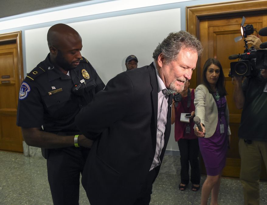 Don Rosenberg, father of Drew Rosenberg who was killed by an illegal immigrant is arrested after disrupting a Senate Judiciary hearing to examine the Administration's immigration enforcement policies, in Washington, Tuesday, July 21, 2015. (AP Photo/Molly Riley)