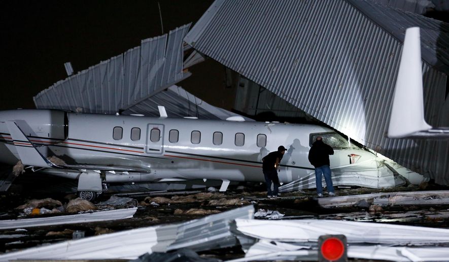High winds damaged an airplane hangar at William P. Hobby Airport Wednesday, April 4, 2018, in Houston. The National Weather Service says gusts of about 60 mph (100 kph) were recorded late Tuesday at the airport. Authorities say the wind appears to have caused the hangar at a private terminal to disintegrate. An airport spokesman, Bill Begley, says the collapse caused millions of dollars of damage. There have been no reports of injuries (Godofredo A. Vasquez /Houston Chronicle via AP)