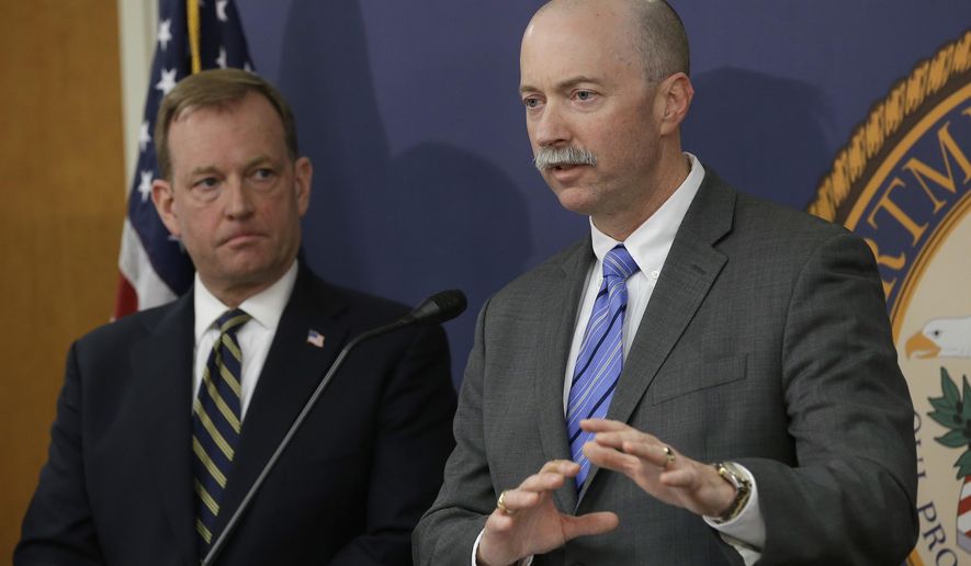 FBI Special Agent in Charge Sean Ragan, right, flanked by McGregor Scott, the United States Attorney For the Eastern District of California, discusses the months-long investigation that led to the law enforcement raids on illegal pot grows in roughly 100 Northern California homes, during a news conference, Wednesday, April 4, 2018, in Sacramento, Calif. The raids, conducted Tuesday and Wednesday in multiple counties, focused on homes purchased with money wired to the United States by a Chinese-based crime organization and used to grow massive amounts of marijuana. (AP Photo/Rich Pedroncelli)