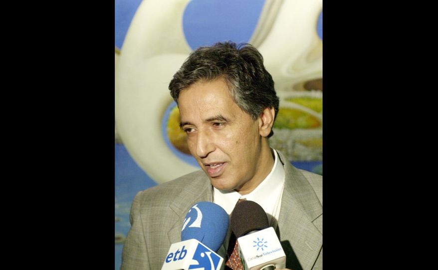 FILE - In this Thursday, July 31, 2003 file photo, Ahmed Boukhari, representative of the Polisario Front rebel movement, speaks to the media after the United Nations Security Council meeting. The head of the Polisario Front movement that seeks independence for the disputed Western Sahara says the group’s representative to the United Nations has died after a long illness. Algeria's official APS news agency published a Polisario Front statement Wednesday, April 4, 2018 saying senior leader Ahmed Boukhari died Tuesday in Spain. (AP Photo/Ed Bailey, file)