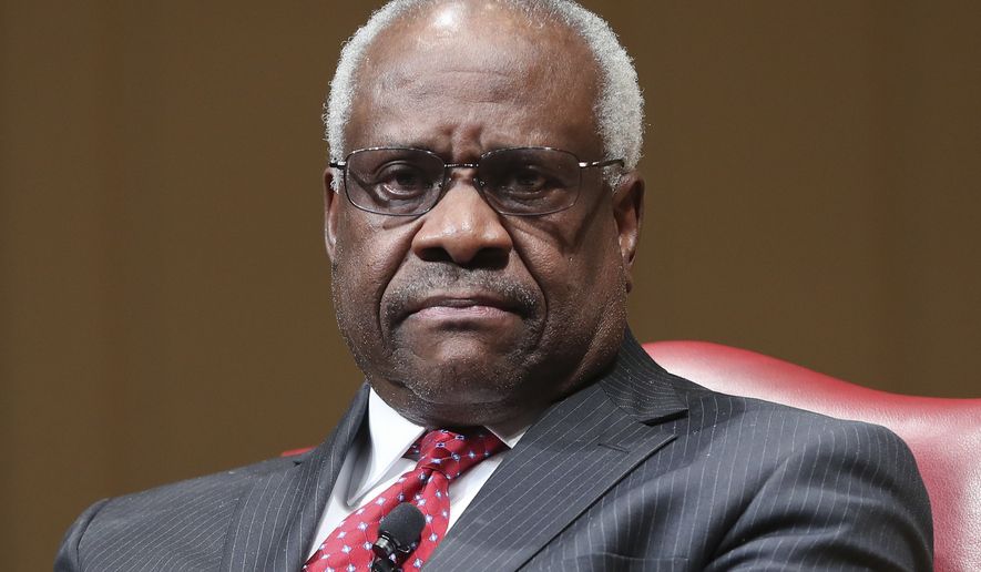 Supreme Court Associate Justice Clarence Thomas sits as he is introduced during an event at the Library of Congress, Thursday, Feb. 15, 2018, in Washington. (AP Photo/Pablo Martinez Monsivais)