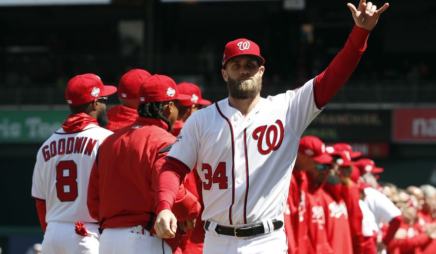 Washington Nationals right fielder Bryce Harper (34) reacts to the fans before the home opener baseball game against the New York Mets at Nationals Park, Thursday, April 5, 2018, in Washington. (AP Photo/Alex Brandon) ** FILE **
