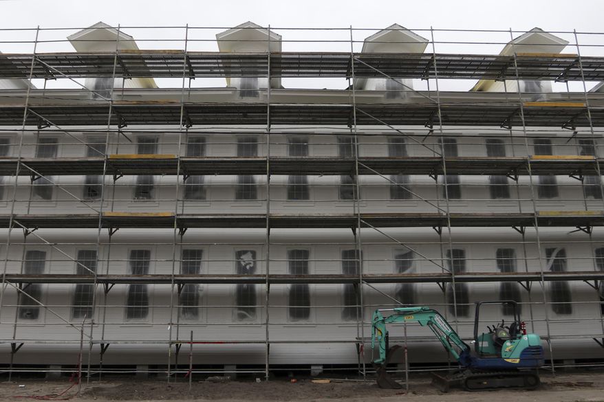 In a Tuesday, March 20, 2018 photo, construction of the Angel Oliva Sr. Apartments is underway, in Tampa, Fla. The 38 apartments inside the historic Oliva Cigar Factory building at 2008 N 19th Street are scheduled to be completed on May 1, 2018. (Alessandra Da Pra/The Tampa Bay Times via AP)