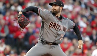 Arizona Diamondbacks starting pitcher Robbie Ray throws during the first inning of a baseball game against the St. Louis Cardinals, Thursday, April 5, 2018, in St. Louis. (AP Photo/Jeff Roberson)