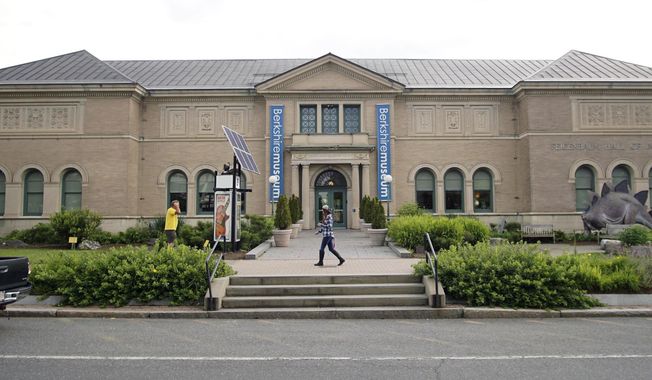 FILE - In this July 12, 2017. file photo, a pedestrian walks past the Berkshire Museum in Pittsfield, Mass. A judge has approved a plan for a cash-strapped Massachusetts museum to sell dozens of pieces of art, including works by Norman Rockwell. The decision Thursday, April 5, 2018, from Justice David Lowy of Massachusetts&#x27; highest court clears the way for the contentious sale of up to 40 pieces of artwork at the Berkshire Museum. (Ben Garver/The Berkshire Eagle via AP, File)