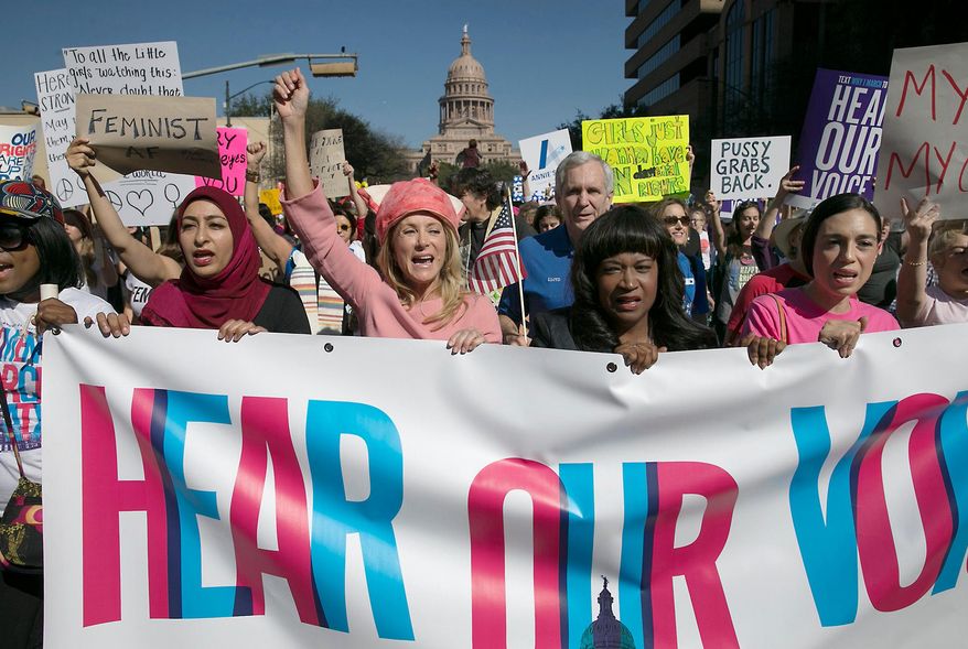ADVANCE FOR USE THURSDAY, APRIL 12, 2018 AT 3:01 A.M. EDT AND THEREAFTER-FILE - In this Saturday, Jan. 21, 2017 file photo, former Texas State Sen. Wendy Davis, center, dressed in all pink, leads the Women's March in Austin, Texas. Davis, who now runs the Austin-based women’s advocacy group Deeds Not Words, recalls being touched “very inappropriately” by a newly elected House member at a 2009 social gathering for lawmakers. She never filed a complaint and wasn’t even aware there was a process for doing so. Often the fear of coming forward and what the consequence of that will look like suppresses anyone from saying anything,” she says. (Ralph Barrera/Austin American-Statesman via AP)