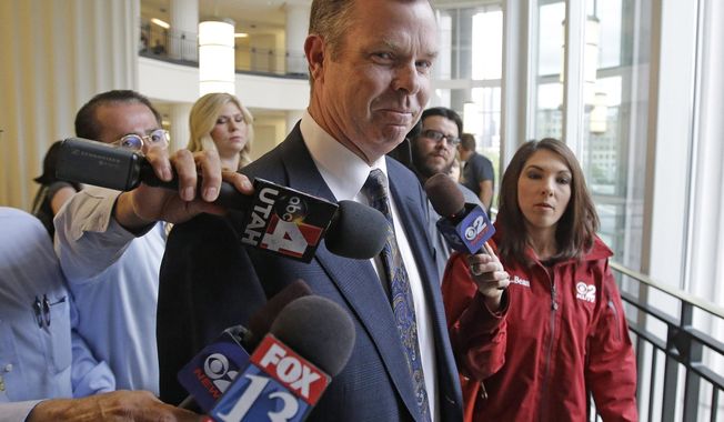 FILE - In this July 30, 2014, file photo, former Utah Attorney General John Swallow arrives at court, in Salt Lake City. A federal judge has dismissed a lawsuit Friday, April 6, 2018, accusing former Utah state Attorney General John Swallow and an imprisoned businessman of illegally funneling donations to the campaigns of Sen. Mike Lee of Utah and others. (AP Photo/Rick Bowmer, File)