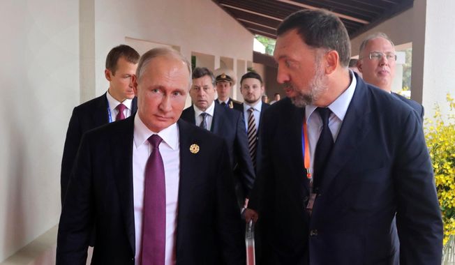 Vladimir Putin crony Oleg Deripask (right), an aluminum magnate, is pleading with the U.S. Treasury to lift sanctions imposed in April. (Associated Press/File)