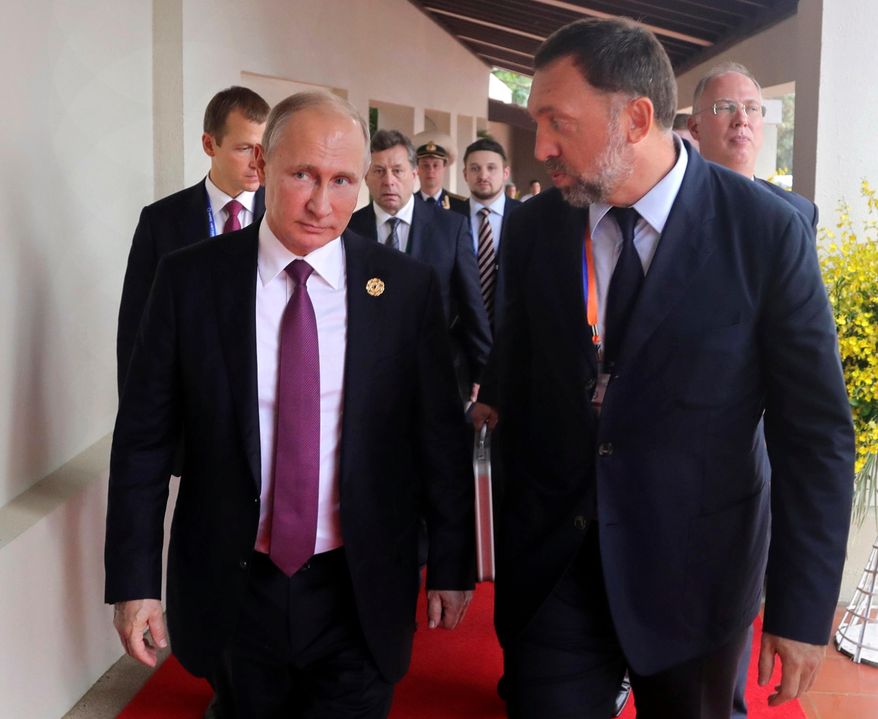 Vladimir Putin crony Oleg Deripask (right), an aluminum magnate, is pleading with the U.S. Treasury to lift sanctions imposed in April. (Associated Press/File)