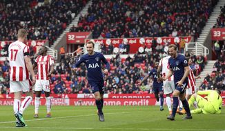 Tottenham Hotspur&#39;s Christian Eriksen celebrates scoring his side&#39;s first goal of the game during the English Premier League soccer match between Stoke City and Tottenham Hotspur at the bet365 Stadium Stoke, England. Saturday, April 7, 2018, 2018. (Nigel French/PA via AP)