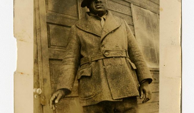 In a photo provided by the Bentley Historical Library, James &amp;quot;Big Jim&amp;quot; Richardson is photographed outside a cabin in Michigan in 1936. The university has acquired a trove of photos capturing a place and time largely overlooked by history: black Civilian Conservation Corps camps during the Great Depression. The photos are the only known images of the state&#x27;s segregated, all-black camps. President Franklin Roosevelt established the corps in the early 1930s to employ a &amp;quot;vast army&amp;quot; of unemployed men and restore national resources. (Bentley Historical Library via AP)