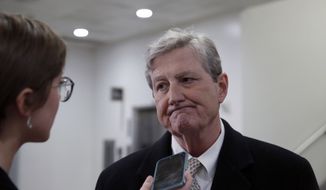 Sen. John Kennedy, R-La., speaks with a reporter on Capitol Hill, Monday, Feb. 12, 2018, in Washington. (AP Photo/Alex Brandon)