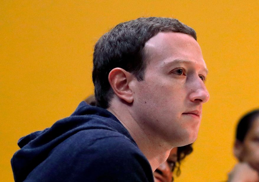 FILE - In this Nov. 9, 2017, file photo, Facebook CEO Mark Zuckerberg meets with a group of entrepreneurs and innovators during a round-table discussion at Cortex Innovation Community technology hub in St. Louis. Congress has lots of questions for Mark Zuckerberg when he testifies before them starting Tuesday, April 10, 2018. (AP Photo/Jeff Roberson, File)