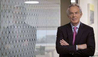 Former Prime Minister Tony Blair stands during an interview about the Good Friday agreement on the eve of its 20th anniversary,  in London, Monday, April 9, 2018. The agreement known as the Good Friday Agreement, was signed by Irish Prime Minister Bertie Ahern and British Prime Minister Tony Blair on April 10, 1998 and brought together Catholic nationalists and Protestant unionists in a government for Northern Ireland&#x27;s Catholics and Protestants. (Stefan Rousseau/PA via AP)