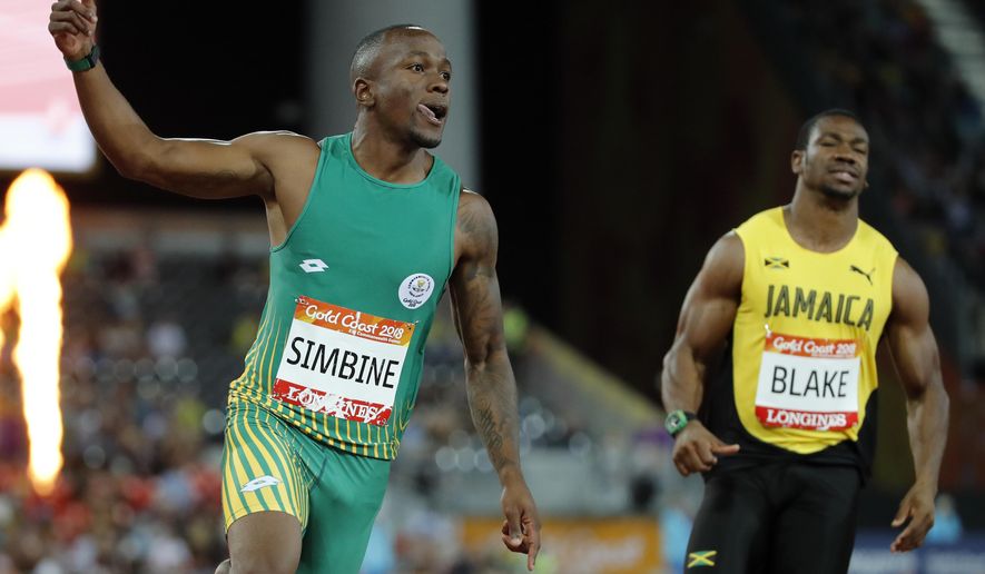 South Africa&#x27;s Akani Simbine, left, celebrates after winning the men&#x27;s 100m final at Carrara Stadium during the 2018 Commonwealth Games on the Gold Coast, Australia, Monday, April 9, 2018.Jamaica&#x27;s Yohan Blake, right, finished third. (AP Photo/Mark Schiefelbein)