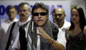 In this March 11, 2013, file photo, Jesus Santrich, member of the negotiating team for Colombia&#39;s Revolutionary Armed Forces of Colombia (FARC), speaks to journalists at the continuation of peace talks with Colombia&#39;s government in Havana, Cuba. The former leader of Colombia’s disbanded rebel army has been arrested, according to former FARC members and the chief prosecutor’s office on Monday, April 9, 2018. (AP Photo/Franklin Reyes, File)