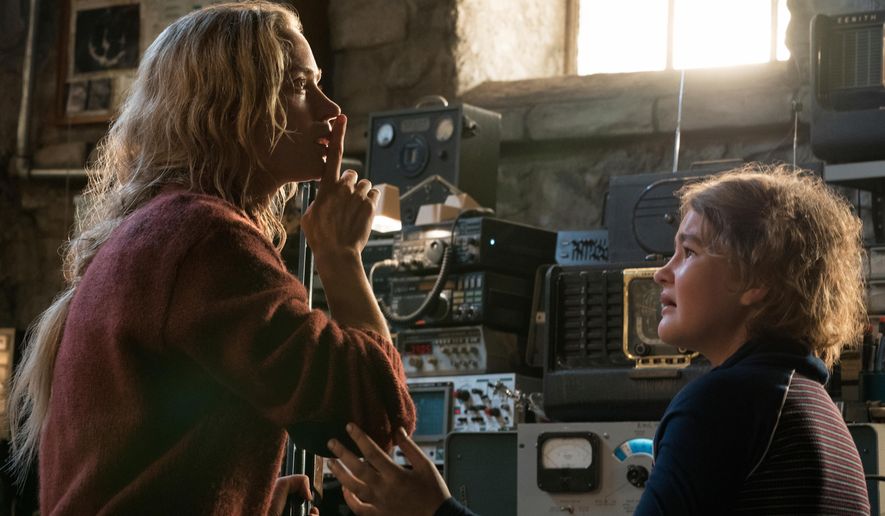 This image released by Paramount Pictures shows Emily Blunt, left, and Millicent Simmonds in a scene from &amp;quot;A Quiet Place.&amp;quot; (Jonny Cournoyer/Paramount Pictures via AP)
