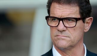 FILE - In this June 14, 2015 file photo, then Russia&#x27;s coach Fabio Capello watches his players during the Euro 2016 qualifying soccer match between Russia and Austria, in Moscow, Russia. Capello, former AC Milan, Real Madrid, Roma and Juventus coach has announced Monday April 9, 2018  his retirement from coaching and that he&#x27;s not interested in the open job with Italy&#x27;s national team. (AP Photo/Ivan Sekretarev, File)