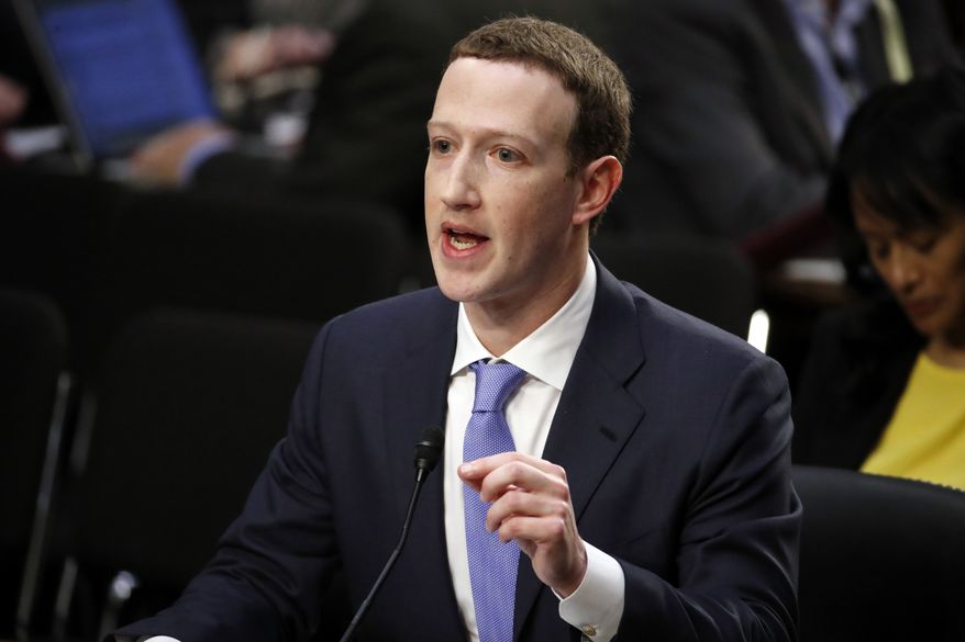 Facebook CEO Mark Zuckerberg testifies before a joint hearing of the Commerce and Judiciary Committees on Capitol Hill in Washington, Tuesday, April 10, 2018, about the use of Facebook data to target American voters in the 2016 election. (AP Photo, Alex Brandon)