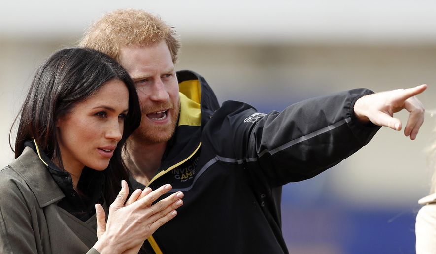 Britain's Prince Harry and his fiancee Meghan Markle attend the UK team trials for the Invictus Games Sydney 2018 at the University of Bath in Bath, England, Friday, April 6, 2018. The Invictus Games is the only international sport event for wounded, injured and sick (WIS) servicemen and women, both serving and veteran. The Invictus Games Sydney 2018 will take place from 20-27th October and will see over 500 competitors from 18 nations compete in 11 adaptive sports. (AP Photo/Frank Augstein)