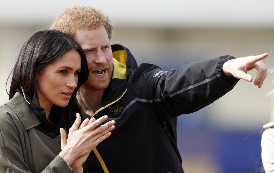 Britain's Prince Harry and his fiancee Meghan Markle attend the UK team trials for the Invictus Games Sydney 2018 at the University of Bath in Bath, England, Friday, April 6, 2018. The Invictus Games is the only international sport event for wounded, injured and sick (WIS) servicemen and women, both serving and veteran. The Invictus Games Sydney 2018 will take place from 20-27th October and will see over 500 competitors from 18 nations compete in 11 adaptive sports. (AP Photo/Frank Augstein)