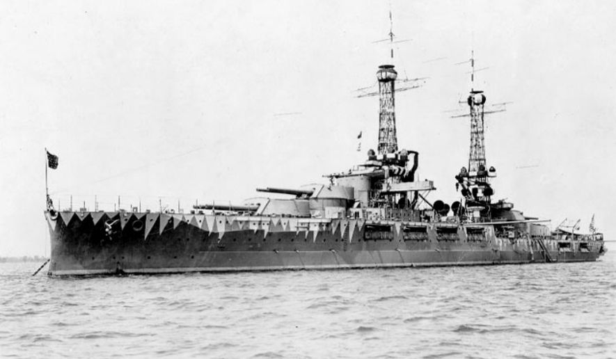 The USS Oklahoma wearing experimental cmouflage, circa 1917, in this U.S. Navy photograph in the public domain, accessed via Wikimedia Commons. The AP reported on April 10, 2018, that Glenn Tipton, a sailor who perished aboard the Oklahoma during the December 7, 1941 attack on Pearl Harbor has been positively identified via DNA samples of relatives. (Wikimedia Commons)