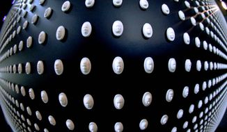 This image made with a fisheye lens, shows a portion of the 22,000 pills with faces carved into them on display in a memorial by the National Safety Council to the victims of the opioid epidemic at the University of Pittsburgh, Monday, Jan. 29, 2018, in Pittsburgh. The exhibit featuring the wall with the carved medicine pills, each representing the face of someone who fatally overdosed, was launched in Chicago in November, 2017. Pittsburgh is the first stop on a nationwide tour. (AP Photo/Keith Srakocic) (Associated Press)