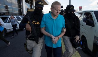 Eric Conn is escorted by SWAT team agents prior to his extradition, at the Toncontin International Airport, in Tegucigalpa, Honduras, Tuesday, Dec. 5, 2017. Conn, a fugitive Kentucky lawyer who escaped before facing sentencing for his central role in a massive Social Security fraud case, was captured as he came out of a restaurant in the coastal city of La Ceiba. (AP Photo/Moises Castillo) ** FILE **