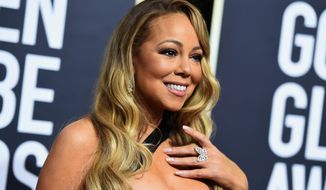 FILE - In this Jan. 7, 2018, file photo, Mariah Carey arrives at the 75th annual Golden Globe Awards at the Beverly Hilton Hotel in Beverly Hills, Calif. Carey said she’s no longer living in isolation after seeking treatment for a bipolar disorder. In a People magazine article due on newsstands Friday, April 13, the singer says she didn’t believe it when she was first diagnosed after she was hospitalized for a physical and mental breakdown in 2001. (Photo by Jordan Strauss/Invision/AP, File)