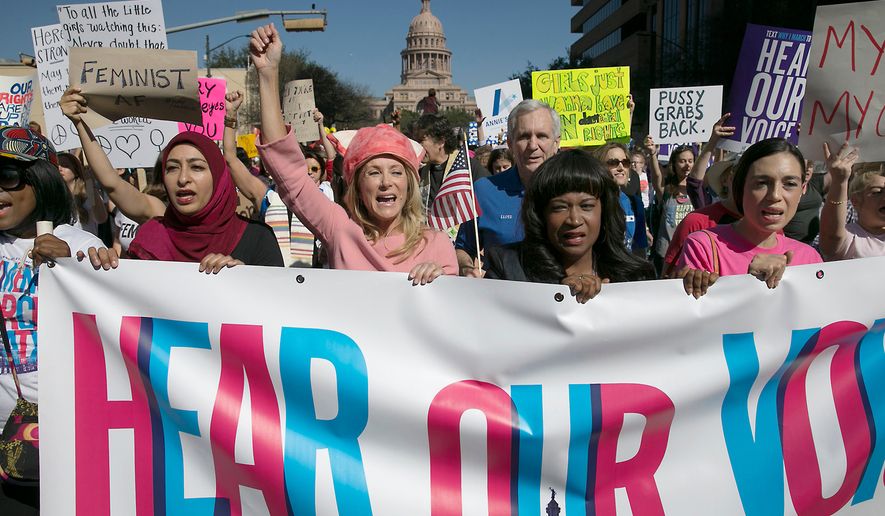 In this Saturday, Jan. 21, 2017, file photo, former Texas State Sen. Wendy Davis, center, dressed in all pink, leads the Women&#39;s March in Austin, Texas. (Ralph Barrera/Austin American-Statesman via AP) ** FILE **
