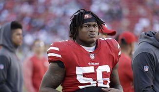 In this Oct. 22, 2017, file photo, San Francisco 49ers linebacker Reuben Foster (56) stands on the sideline during an NFL football game against the Dallas Cowboys in Santa Clara, Calif. Authorities say San Francisco 49ers linebacker Reuben Foster has been charged with felony domestic violence after being accused of attacking his girlfriend. The Santa Clara County District Attorney says Foster was charged Thursday, April 12, 2018, and is scheduled to be arraigned later in the day in San Jose. (AP Photo/Marcio Jose Sanchez) ** FILE **