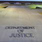 The Department of Justice headquarters building in Washington is photographed early in the morning on May 14, 2013. (Associated Press) **FILE**