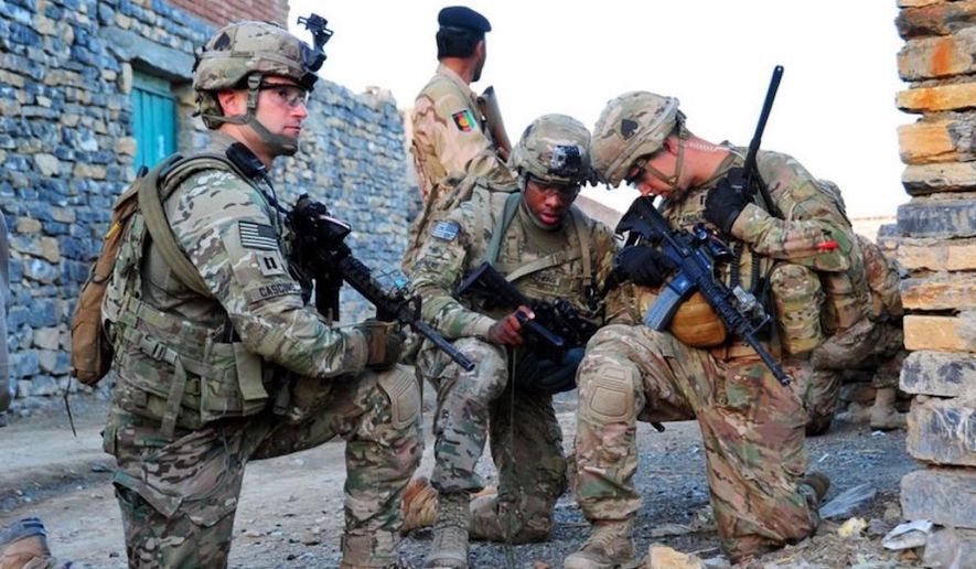 Members of Easy Company, 2nd Battalion, 506th Infantry Regiment, 4th Brigade Combat Team, 101st Airborne Division (Air Assault), pull security during a partnered patrol in Madi Khel, Khowst Province, Afghanistan, Oct. 20, 2013. (U.S. Army photo) ** FILE **