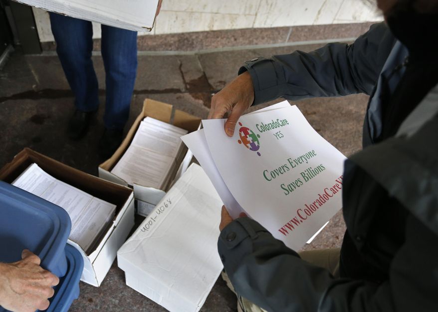 FILE - In this Oct. 23, 2015 file photo, volunteers help deliver petition signatures to put a health care question on the 2016 Colorado ballot. A federal appeals court has stopped a judge’s order blocking parts of Colorado's Amendment 71, which makes it more difficult for citizens to get any proposed constitutional amendments onto ballots, from taking effect. The ruling by the 10th U.S. Circuit Court of Appeals puts the amendment temporarily back in effect for petition signatures for any constitutional initiatives proposed for the November 2018 ballot, according to the Colorado Secretary of State's Office. (AP Photo/Brennan Linsley, File)