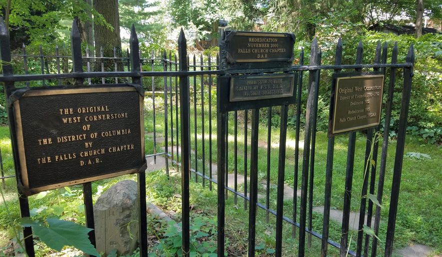 In this  June 20, 2017 photo, various plaques note the work the Daughters of the American Revolution have done to preserve the West stone in Falls Church, Va. (William Vitka via WTOP)