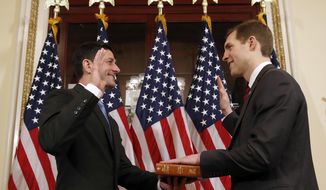 House Speaker Paul Ryan of Wis., left, and Democrat Conor Lamb of Pa., participate in a mock swearing-in ceremony on Capitol Hill, Thursday, April 12, 2018 in Washington. (AP Photo/Alex Brandon)