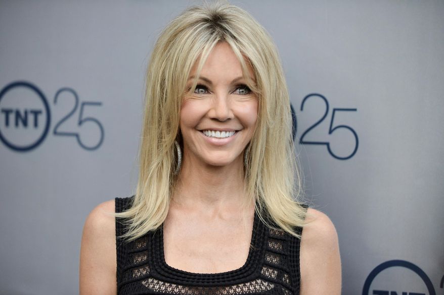 FILE - In a July 24, 2013 file photo, Heather Locklear arrives at the TNT 25th Anniversary Party at The Beverly Hilton Hotel in Los Angeles. Locklear has pleaded not guilty to attacking deputies who answered a domestic violence call at her Southern California home. Locklear’s attorney entered the plea on her behalf in Ventura County Superior Court on Thursday to four misdemeanor counts of battery on an officer. A pretrial hearing is scheduled June 7. (Photo by Richard Shotwell/Invision/AP, File)