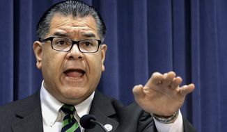 In this March 25, 2014 file photo, Illinois Sen. Martin Sandoval, D-Cicero, speaks during a news conference at the Illinois state Capitol, in Springfield, Ill. (AP Photo/Seth Perlman File)