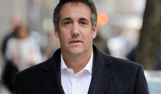 In this Wednesday, April 11, 2018, photo, Michael Cohen, President Donald Trump&#x27;s personal attorney, walks along a sidewalk in New York. The company that publishes the National Enquirer paid a former doorman at one of Trump’s New York skyscrapers $30,000 during the presidential campaign for a tip about Trump it never ran. Dino Sajudin signed a contract with American Media Inc. that barred him from discussing his tip with anyone. Cohen acknowledged to the AP that he had discussed Sajudin’s story with the magazine when the tabloid was working on it. He said he was acting as a Trump spokesman when he did so and denied knowing anything beforehand about the Enquirer payment to the ex-doorman. (AP Photo/Seth Wenig)