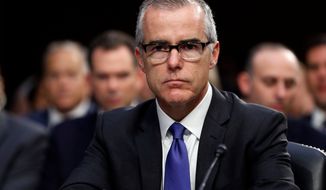 FILE - In this June 7, 2017 file photo, then-acting FBI Director Andrew McCabe appears before a Senate Intelligence Committee hearing about the Foreign Intelligence Surveillance Act on Capitol Hill in Washington. McCabe misled investigators multiple times about his role in a news media disclosure about Hillary Clinton just days before the 2016 presidential election, according to a Justice Department watchdog report. The report alleges that McCabe authorized FBI officials to speak with a Wall Street Journal reporter for a story about an investigation into the Clinton Foundation and then misled FBI and Justice Department officials when later questioned about it. (AP Photo/Alex Brandon, File)