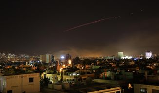 Explosions lit up the skies with anti-aircraft fire, over Damascus, the Syrian capital, as the U.S. launches an attack on Syria targeting different parts of the Syrian capital Damascus, Syria, early Saturday, April 14, 2018. Syria&#39;s capital has been rocked by loud explosions that lit up the sky with heavy smoke as U.S. President Donald Trump announced airstrikes in retaliation for the country&#39;s alleged use of chemical weapons. (AP Photo/Hassan Ammar)
