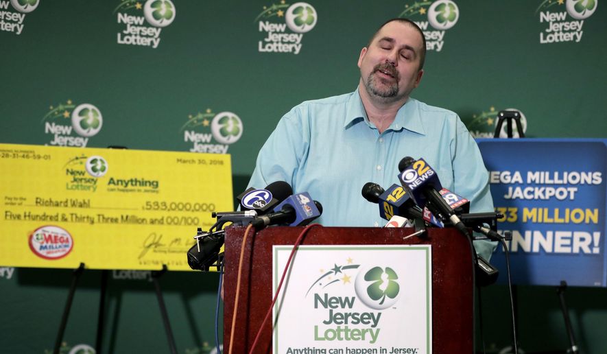 Richard Wahl reacts while speaking during a news conference introducing him as the $533 million Mega Millions jackpot winner at the New Jersey Lottery headquarters, Friday, April 13, 2018, in Trenton, N.J. Wahl hit the winning numbers during the Friday, March 30 drawing on a ticket he bought at a gas station in Riverdale, N.J. (AP Photo/Julio Cortez)