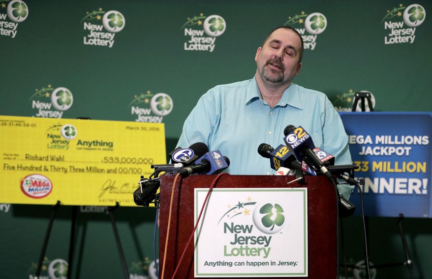 Richard Wahl reacts while speaking during a news conference introducing him as the $533 million Mega Millions jackpot winner at the New Jersey Lottery headquarters, Friday, April 13, 2018, in Trenton, N.J. Wahl hit the winning numbers during the Friday, March 30 drawing on a ticket he bought at a gas station in Riverdale, N.J. (AP Photo/Julio Cortez)