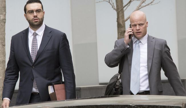 Michael Cohen&#x27;s attorneys Todd Harrison, right, and Joseph Evans arrive at Federal court, Friday, April 13, 2018, in New York.  A  hearing has been scheduled before U.S. District Judge Kimba Wood  to address Cohen&#x27;s request for a temporary restraining order related to the judicial warrant that authorized a search of his Manhattan office, apartment and hotel room this week. (AP Photo/Mary Altaffer)