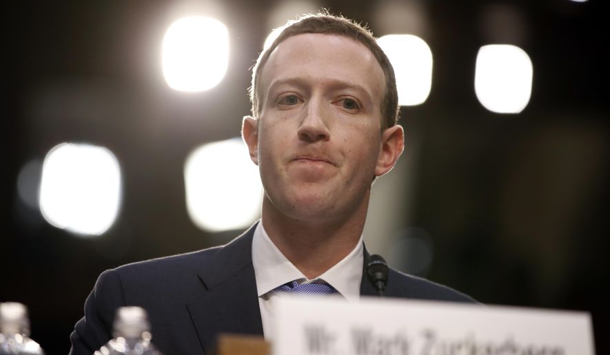 Facebook CEO Mark Zuckerberg testifies before a joint hearing of the Commerce and Judiciary Committees on Capitol Hill in Washington, Tuesday, April 10, 2018, about the use of Facebook data to target American voters in the 2016 election. (AP Photo/Alex Brandon) ** FILE **